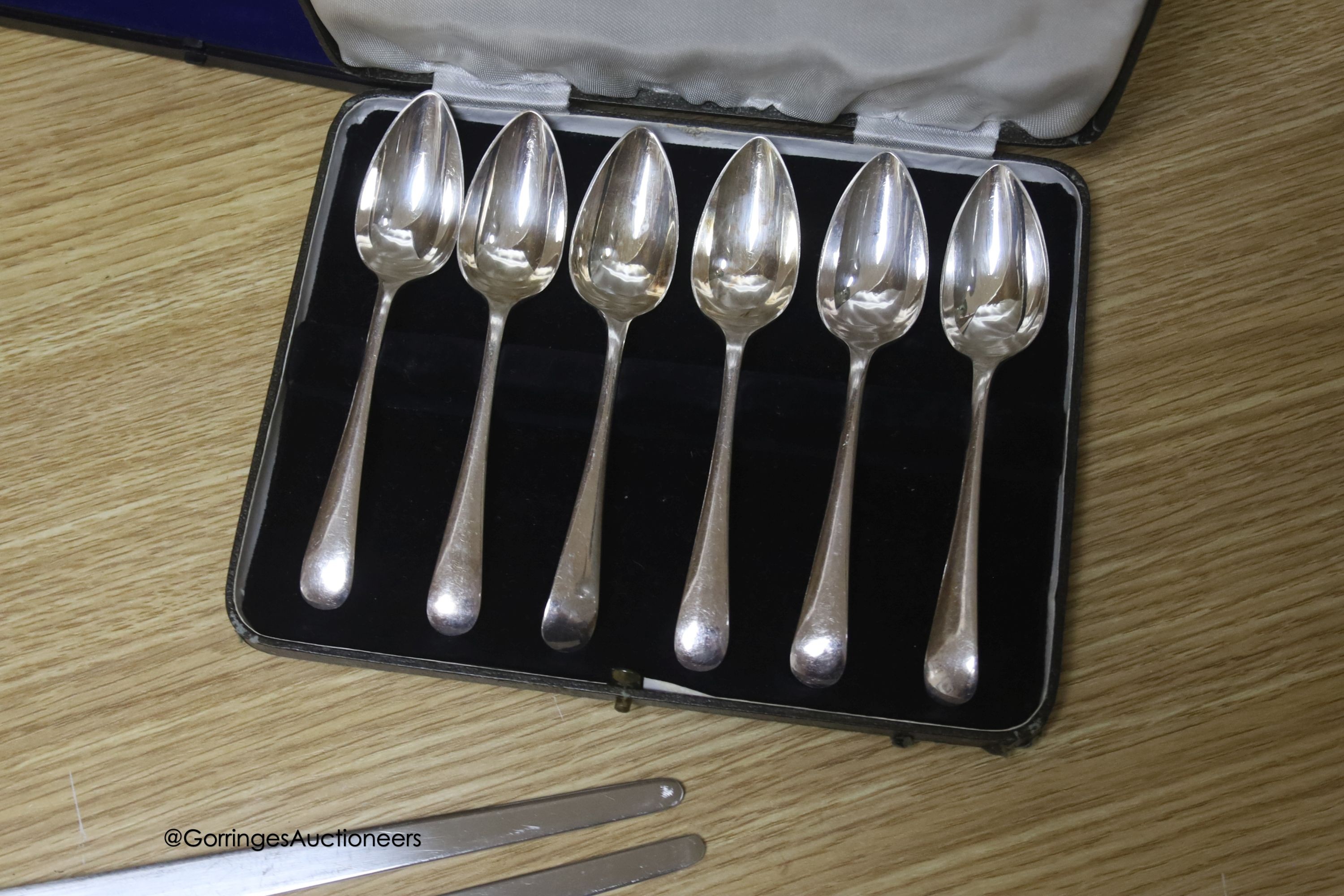 A group of plated ware including a pair of Georg Jensen salad servers